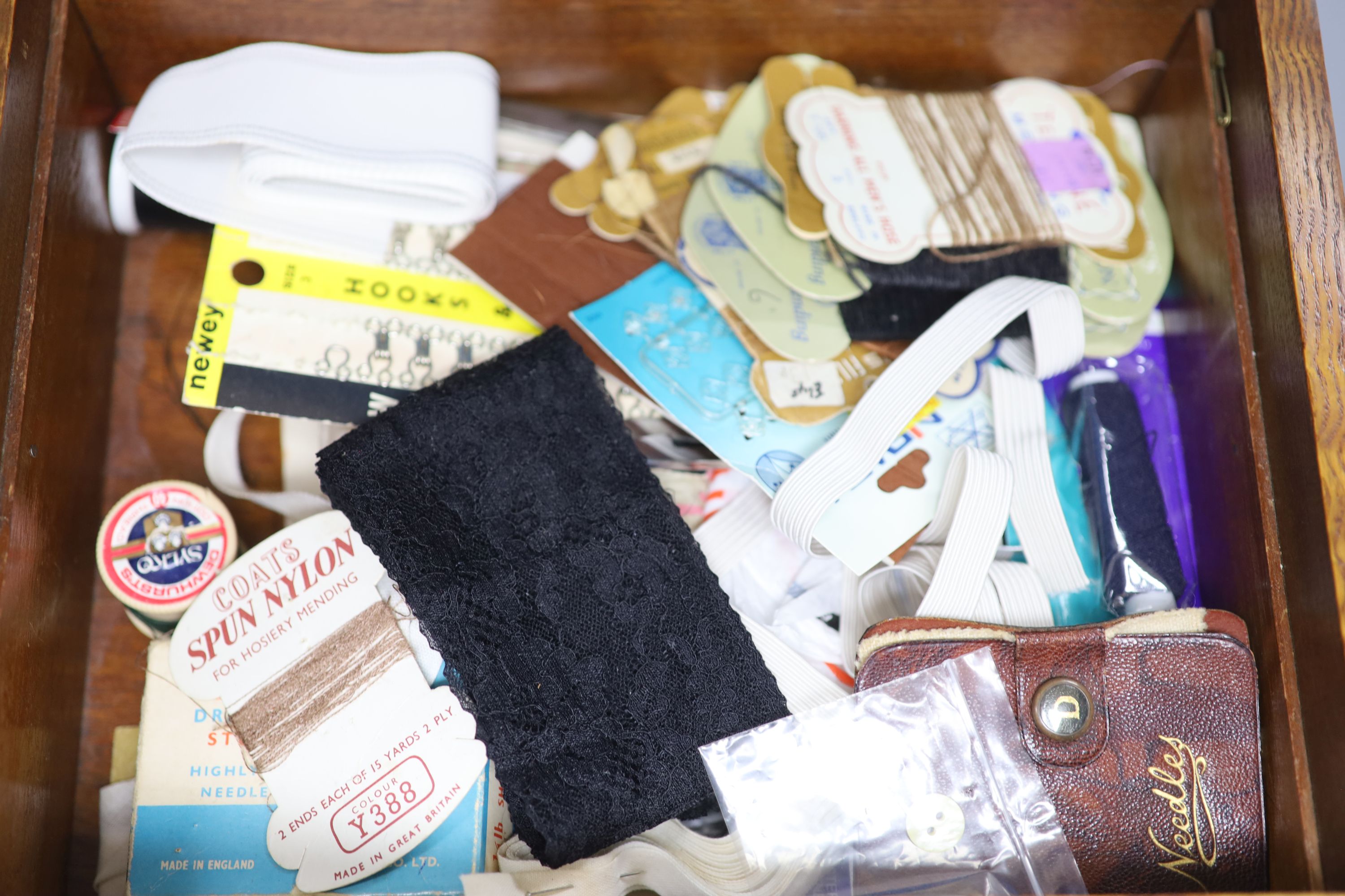 Various modern pill boxes, a pollard oak sewing box with contents, a leather jewellery case, a silver-mounted hand mirror, etc.